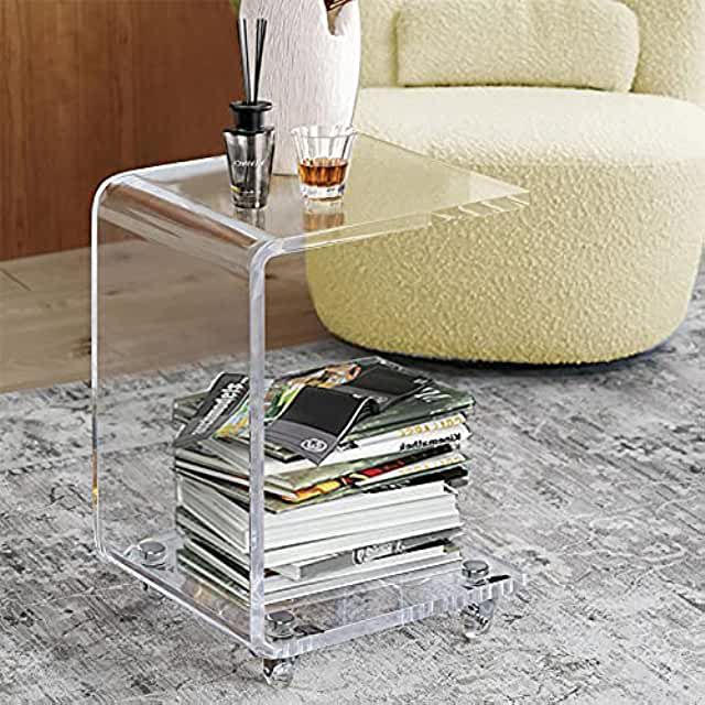 Photo of a clear, acrylic side table holding books