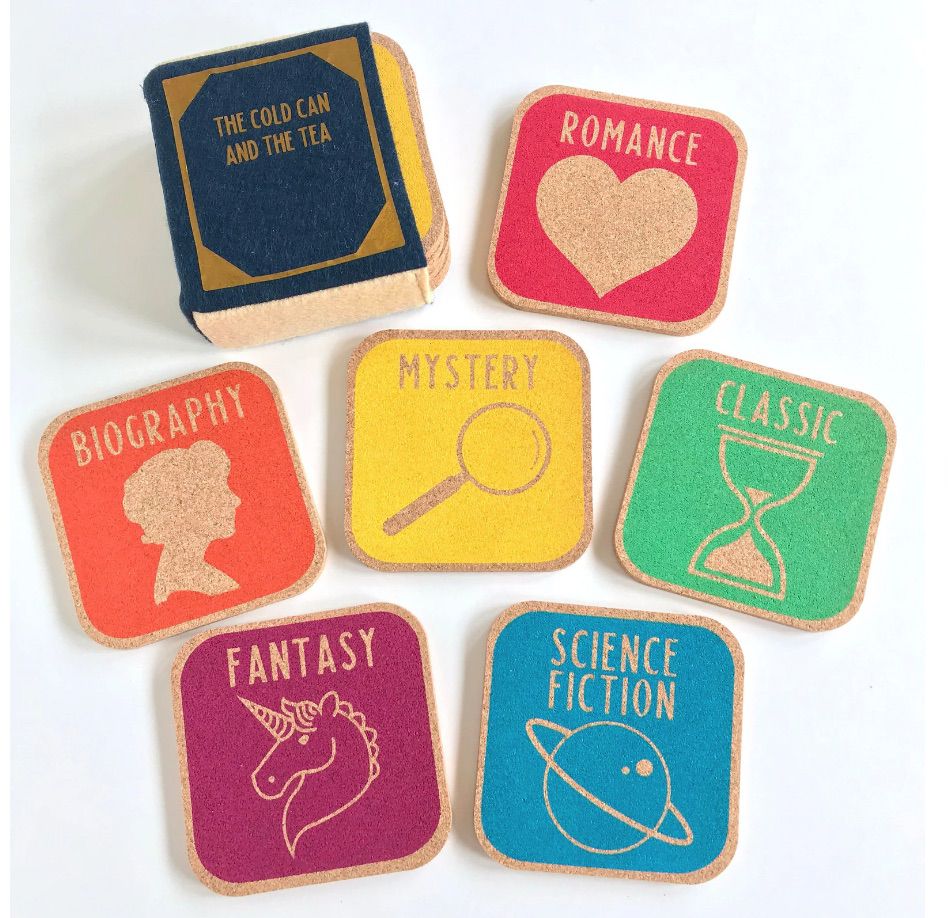 Image of six brightly colored cork coasters. Each has a book genre on it. 