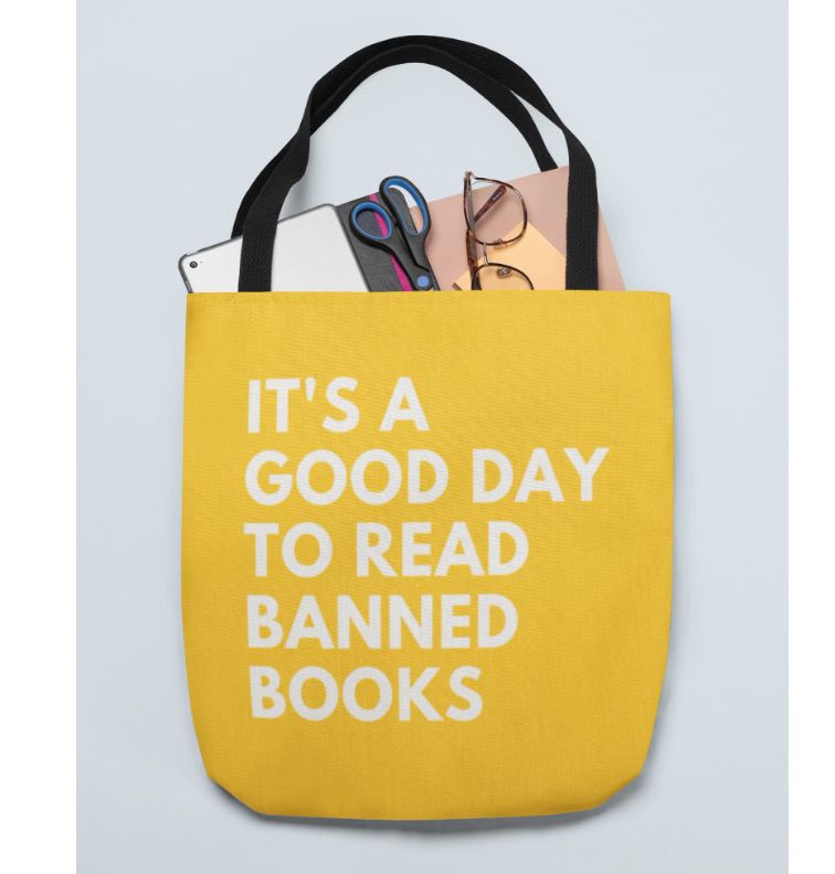 Image of a bright yellow tote bag with white text that says "it's a good day to read banned books."
