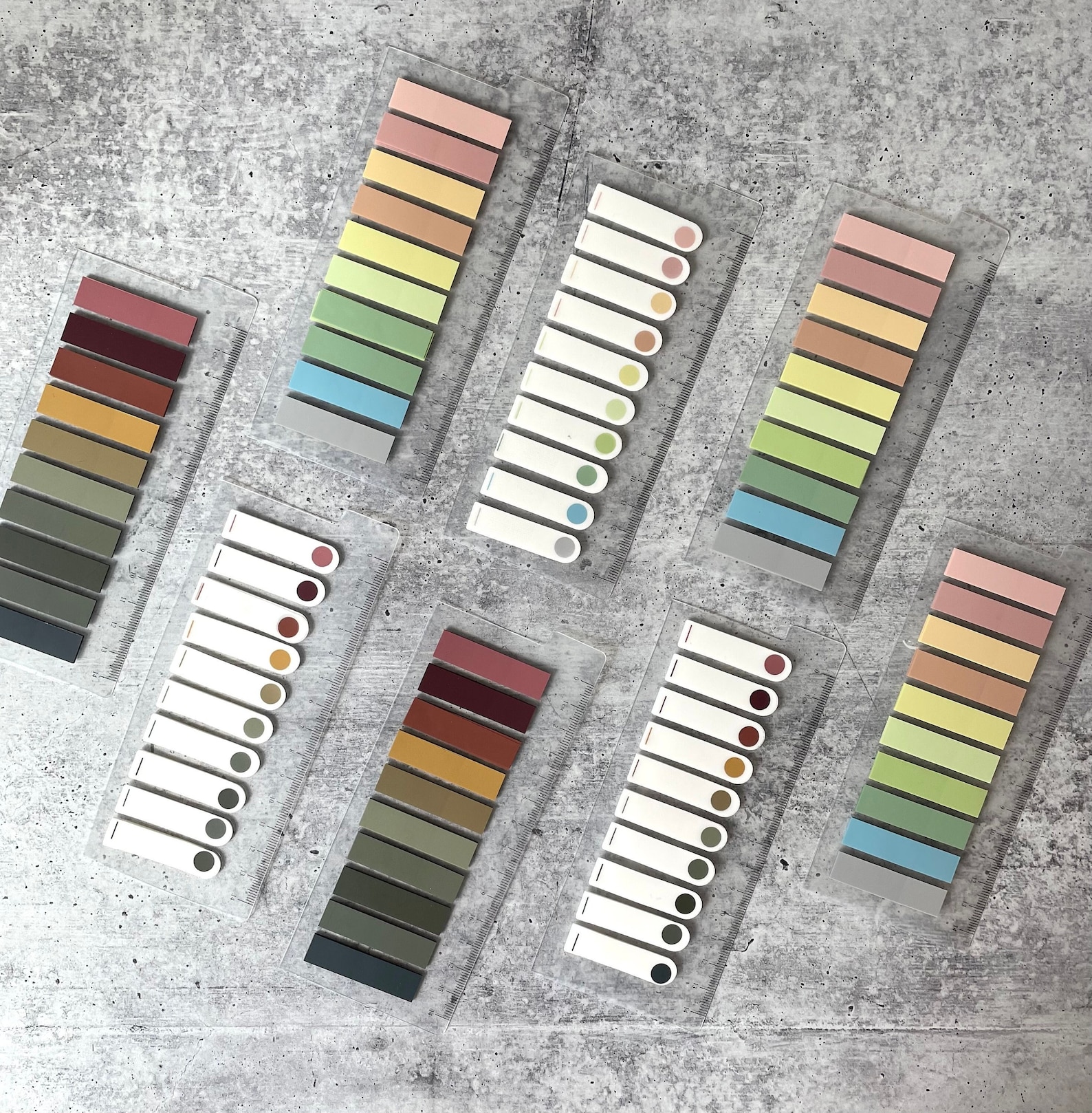 A picture of a variety of book tabs in neutral tones.