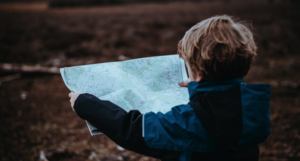 kid holding a map